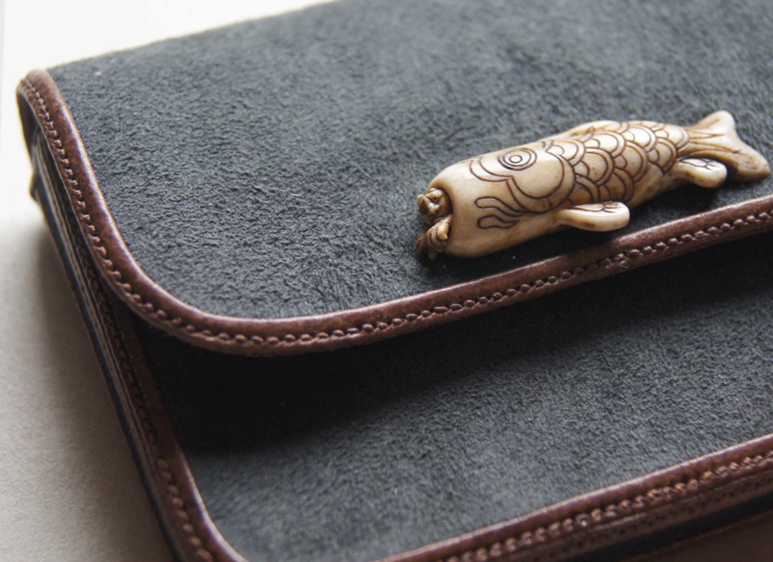 card case with a demon in a carp