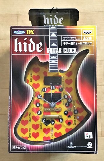 hide　ギター型・ウォール・クロック　イエローハート　壁掛け時計：全長約38cm×15cm　組み立て式　未使用 - ロックオンキング