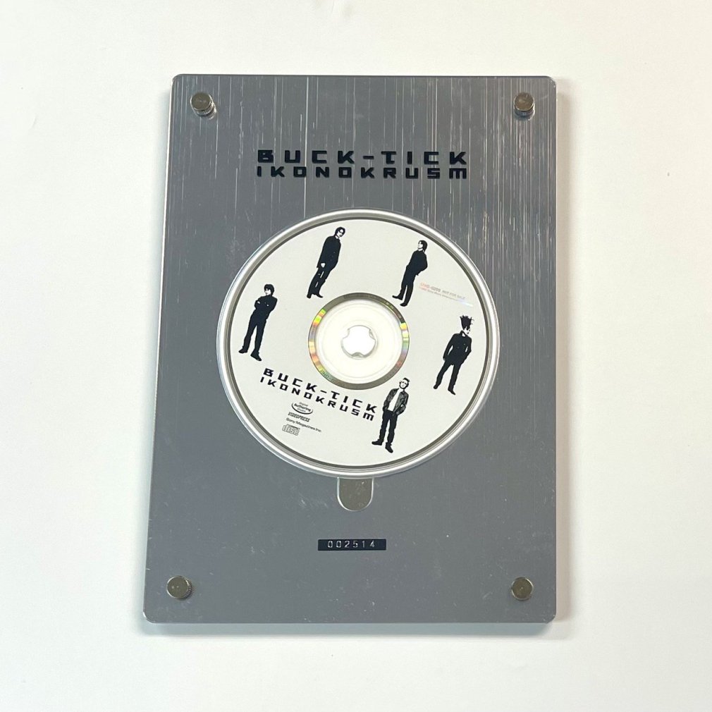 BUCK-TICK 「IKONOKRUSM」　写真集BOX / フレーム付きCD-ROM（シリアルナンバー付）・赤と緑の写真集＆インタビュー集 -  ロックオンキング