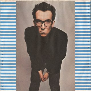 <img class='new_mark_img1' src='https://img.shop-pro.jp/img/new/icons15.gif' style='border:none;display:inline;margin:0px;padding:0px;width:auto;' />ELVIS COSTELLO & THE ATTRACTIONS - Watching The Detectives