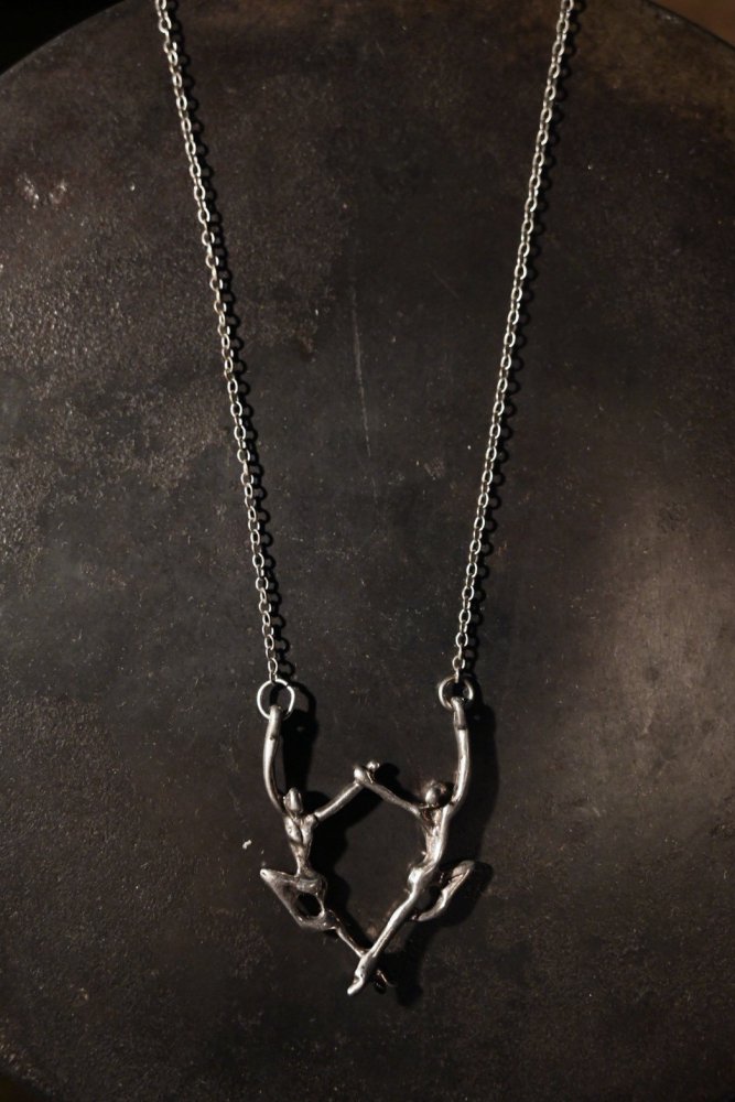 Vintage dance motif silver necklace