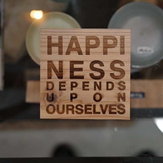coaster / Happiness depends upon ourselves.