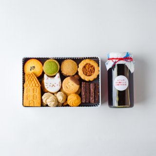 ねこクッキー缶（ネコと桜）と焦がしキャラメルベースのセットの商品画像