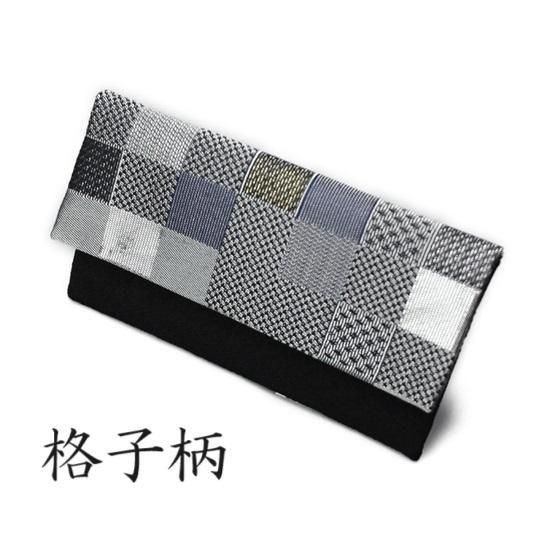 数珠 女性用 黒オニキス 約7mm 赤瑪瑙(あかめのう)仕立 正絹房(しょうけんふさ)の写真