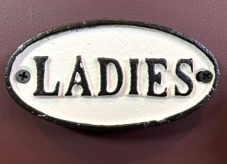 Iron oval sign LADIES WH